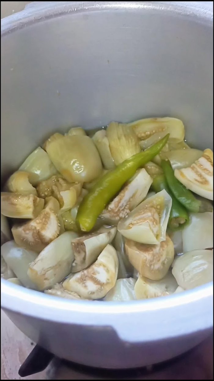Allow the cooked brinjal to cool completely. Blend it in a mixer until smooth.