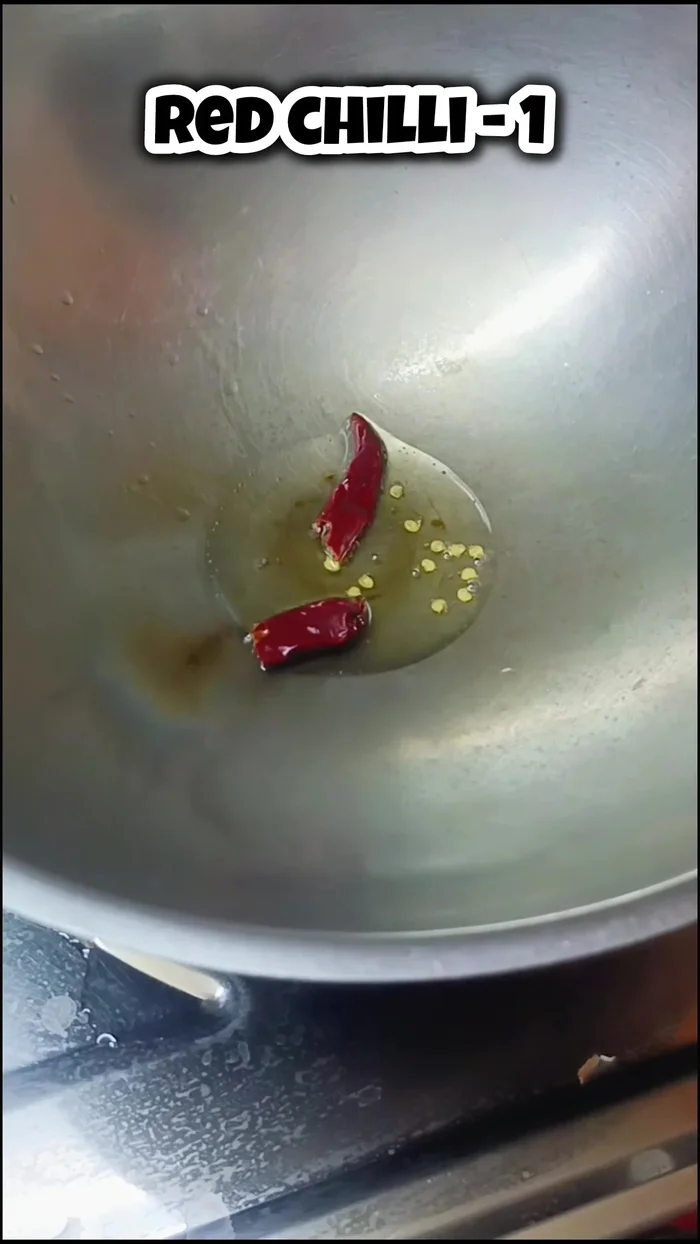 Add 1 teaspoon of urad dal and fry until it changes color. Add mustard seeds and fry well.