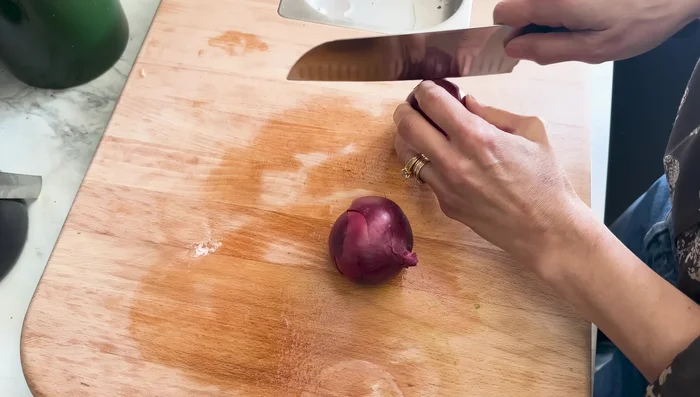 For the last 5 minutes of cooking, add thinly sliced red onions and garam masala. Stir to combine.