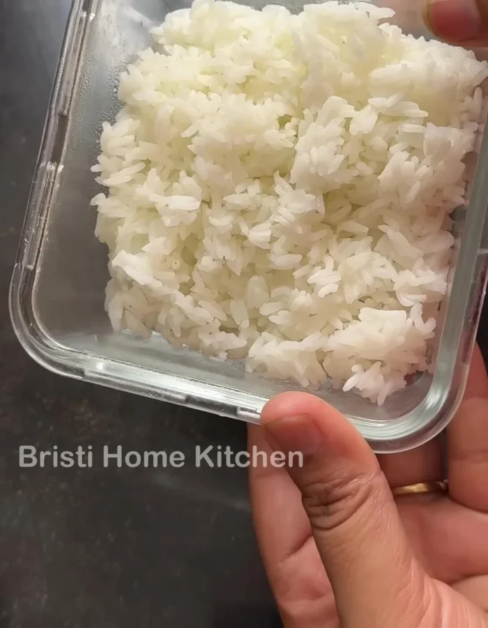 Combine leftover rice, semolina, curd, and mix well. Add water if needed to adjust consistency. If it's too wet, add more semolina. Let it rest for 3 minutes for semolina to swell (optional, skip if using other flour).