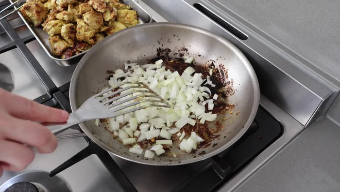 Prepare Sauce: In the same pan, sauté chopped onion with salt until softened (about 5 minutes). Add garlic and ginger and cook until fragrant. Add curcuma, turmeric, paprika, and chili flakes. Mix well and let the spices bloom for about 20-30 seconds.