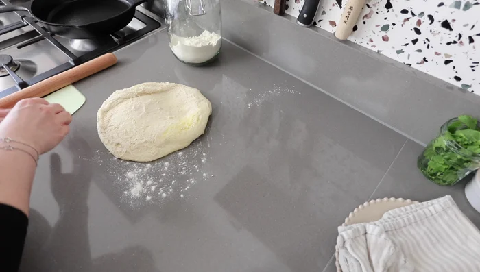 Make Naan Bread: Divide the risen dough into 6 pieces. Shape each piece into a ball, then flatten into an oval shape using a rolling pin. Cook naan bread on a very hot cast iron pan for a couple of minutes per side, until puffed and slightly charred.