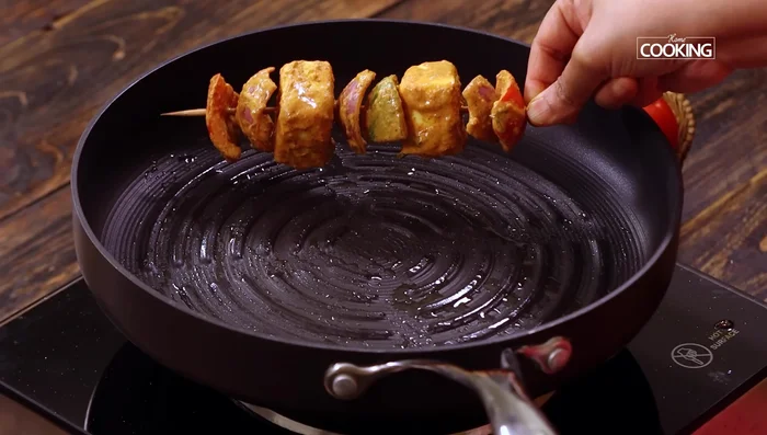 Grill skewers: Heat a grill pan, brush with ghee, and grill skewers, turning frequently, until cooked through.
