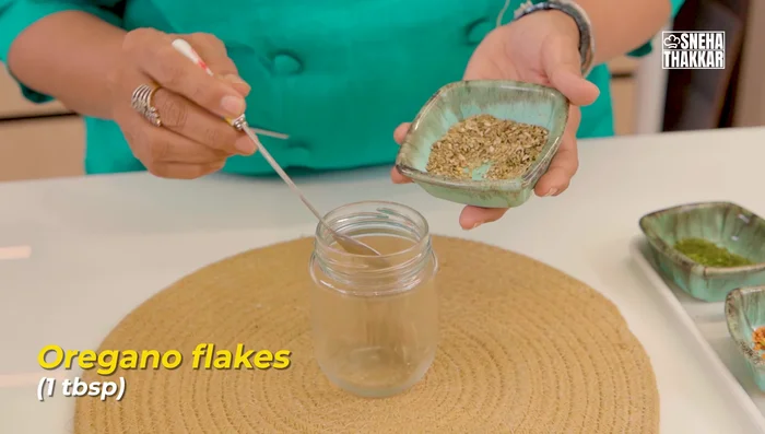 Prepare oregano seasoning: Combine garlic powder, red chili powder, black pepper powder, dry basil powder, chili flakes, and garlic granules in a jar. Shake well.
