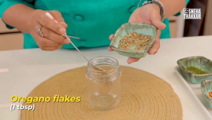 Prepare garlic butter: Melt butter slightly. Mix in freshly chopped garlic, oregano seasoning, and freshly chopped coriander.