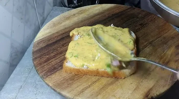 Cook the bread in a lightly oiled pan, applying the batter on both sides. Cook until golden brown.
