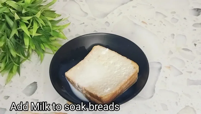 Take bread (brown bread, flour bread, or refined flour bread works). Pour some slightly warm milk over it and mash it well. Let it soak completely.