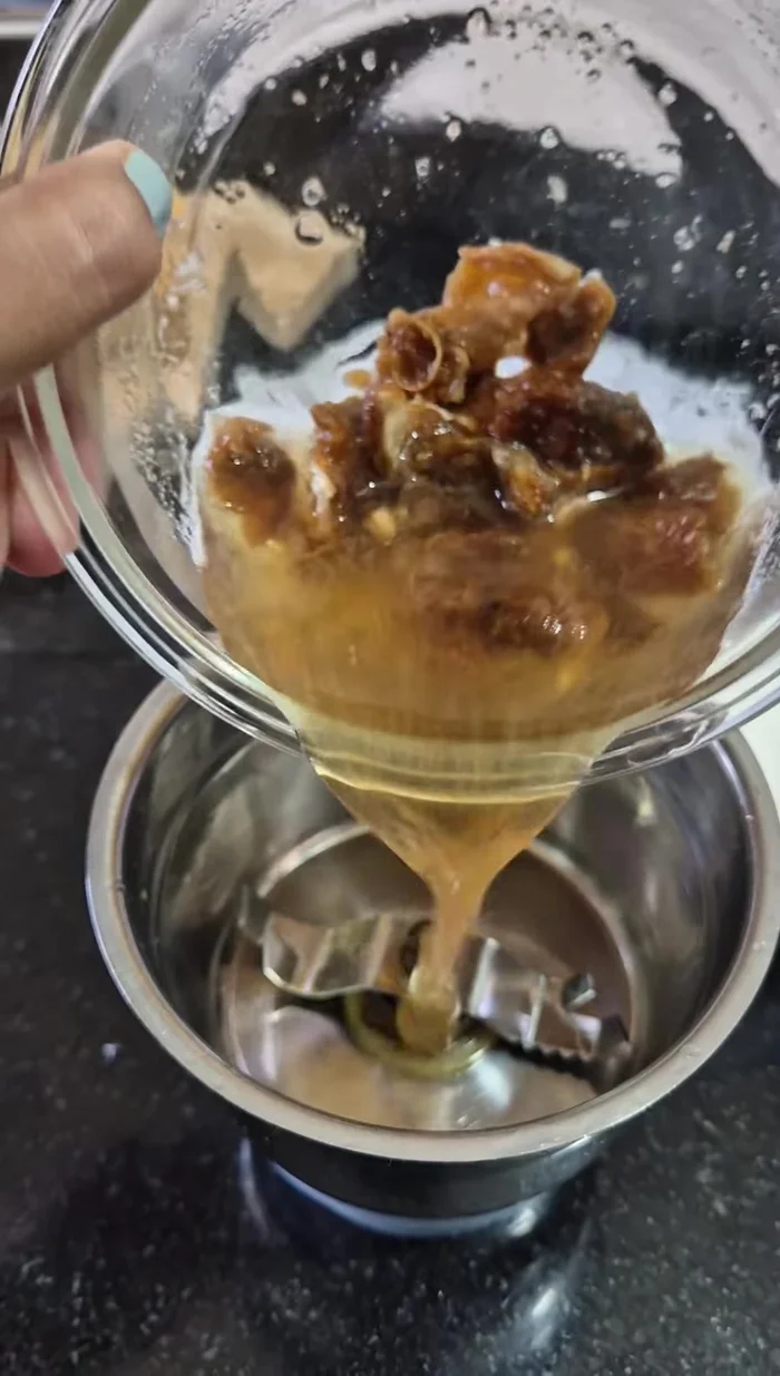 Whisk curd with water.