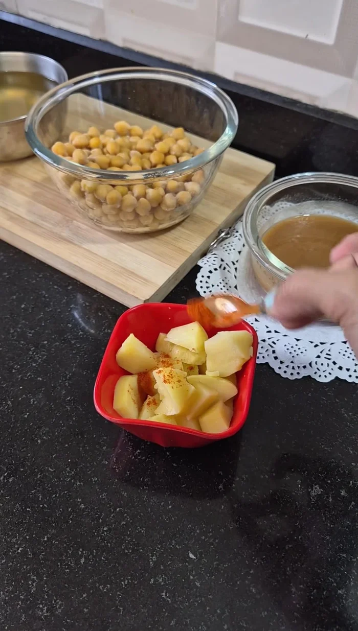 Chop boiled potatoes, adding salt and chilli powder.