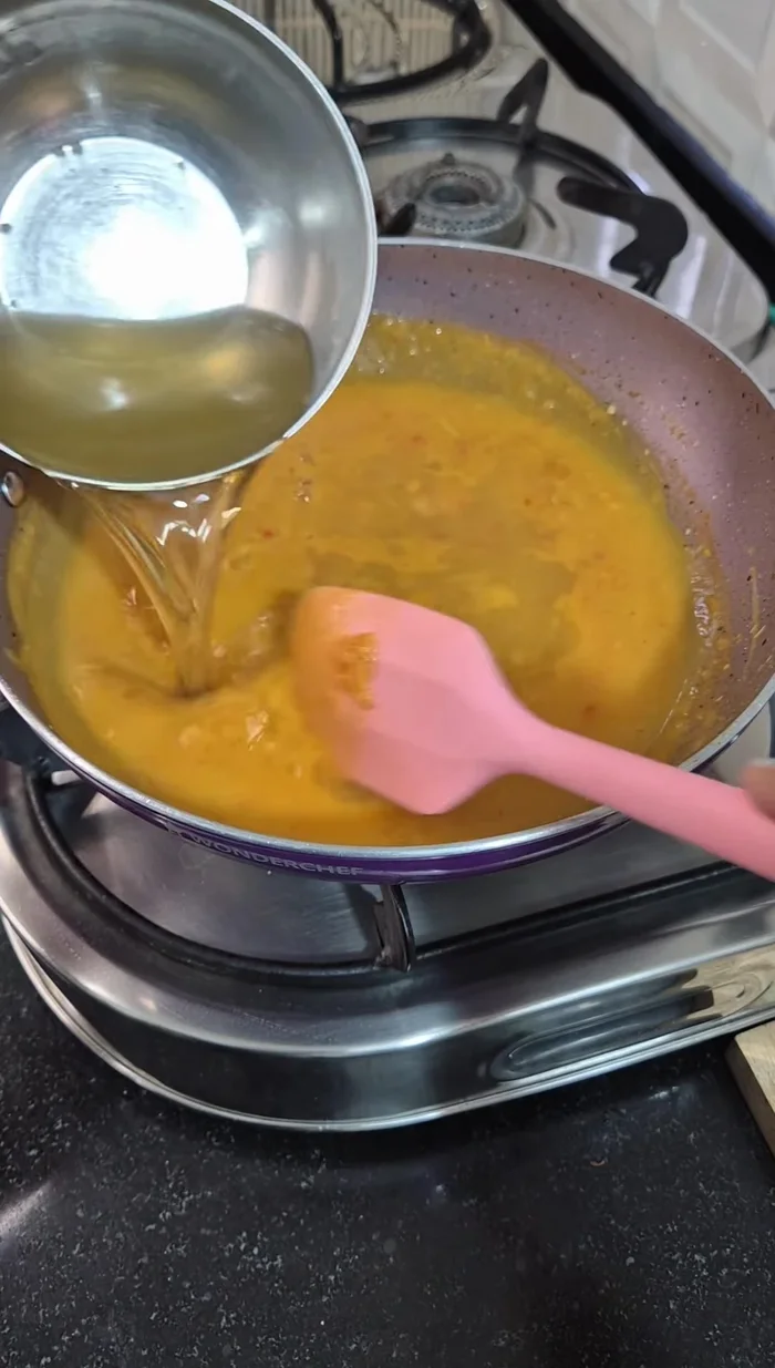 Add chickpeas, mash some for thickening, and add water as needed. Stir in green coriander, green chillies, and tamarind chutney. Add salt to taste. Cover and cook for 5-10 minutes.