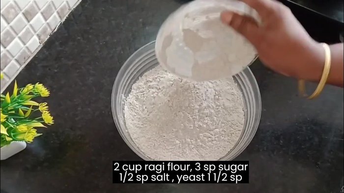 Mix 2 cups of ragi flour, 3 tablespoons of powdered sugar, 1 tablespoon of yeast, and ½ teaspoon of salt.
