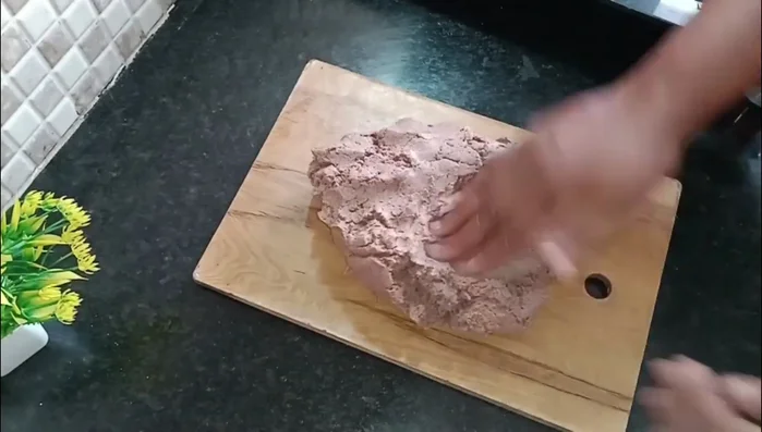 After resting, knead the dough again until smooth. Adding a cup of beetroot can improve texture.