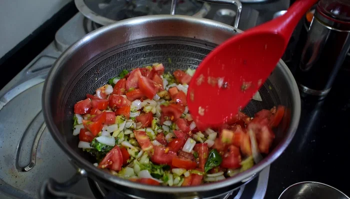 Add chopped tomatoes and cook until softened.
