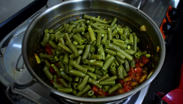Add the boiled fenugreek leaves to the pan. Mix and cook for a few minutes.