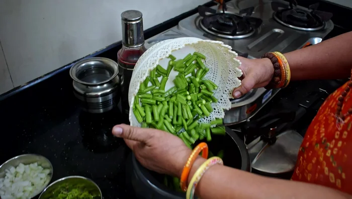 Boil fenugreek leaves in a cooker with a little water and salt. Cook until two whistles.