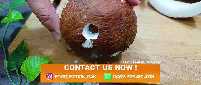Make a small hole in the coconut using a knife to drain the water into a bowl.