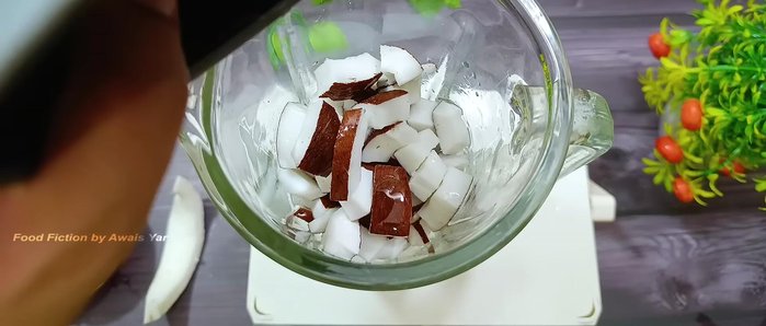 Add the previously extracted coconut water and enough additional water to submerge the coconut pieces.