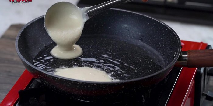 Heat oil over medium heat. Pour a ladle of batter and fry gently until both sides turn golden brown.