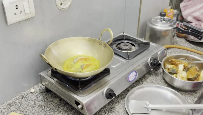 Heat oil in a pan. Carefully add fish pieces, frying until golden brown on both sides. Use a sieve to avoid splattering.