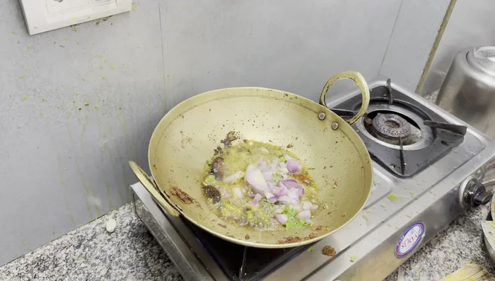 Add chopped onions and fry until golden brown.