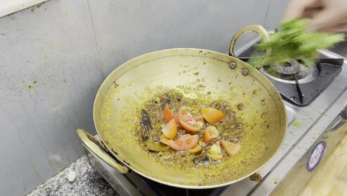 Add chopped tomatoes and fry until they become a puree.