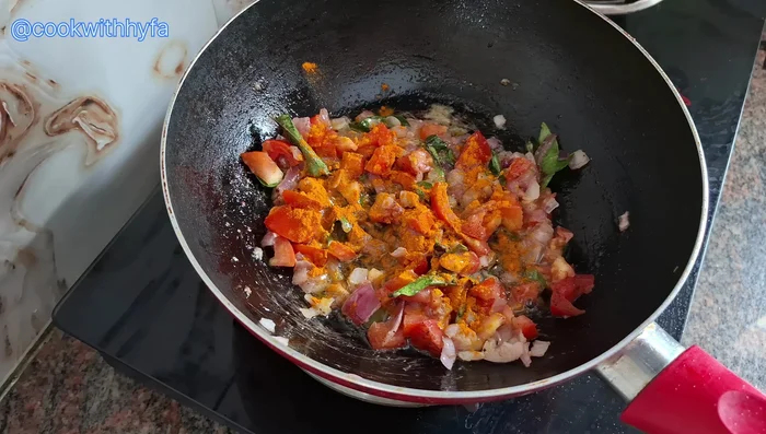 Stir in ½ teaspoon garam masala powder and ½ teaspoon turmeric powder. Sauté well.