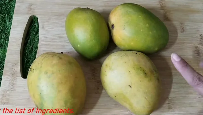 Peel and puree 2 ripe, sweet mangoes. The mangoes should be naturally sweet and colorful; no artificial coloring is needed.