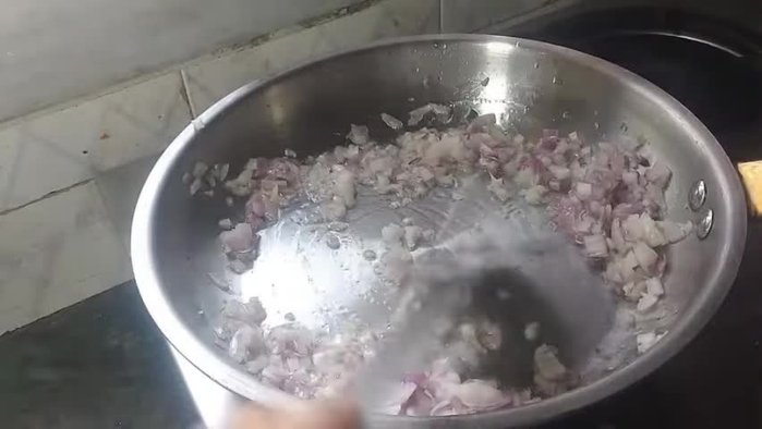 Add salt, oregano, chilli flakes, black pepper powder, and chaat masala. Mix well and fry on high flame until coated.