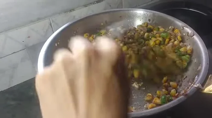 Turn off the gas. Add grated cheese and paneer. Mix well.