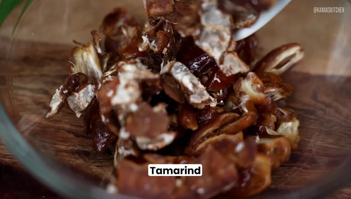 Add the ground paste to the pan and sauté until the raw smell disappears.