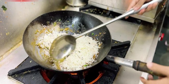Add Bagha rice and toss it well with the masala.