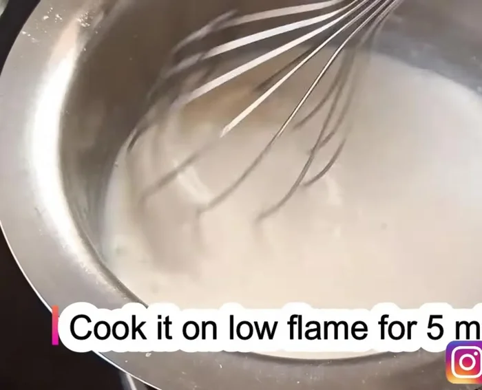 Cook the mixture on low heat for 4-5 minutes, stirring continuously, until it boils and thickens.
