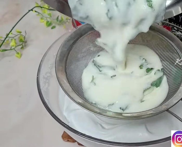 Strain the cooled mint milk mixture to remove the leaves. Make a paste from the remaining mint leaves and add it to the strained mixture.