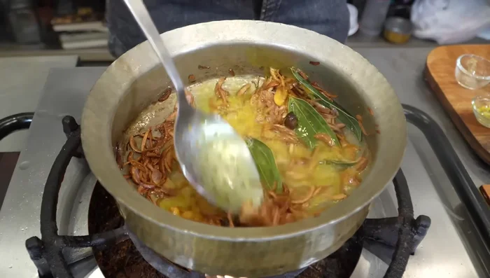 Add ginger-garlic paste and turmeric powder. Fry until the raw smell disappears.