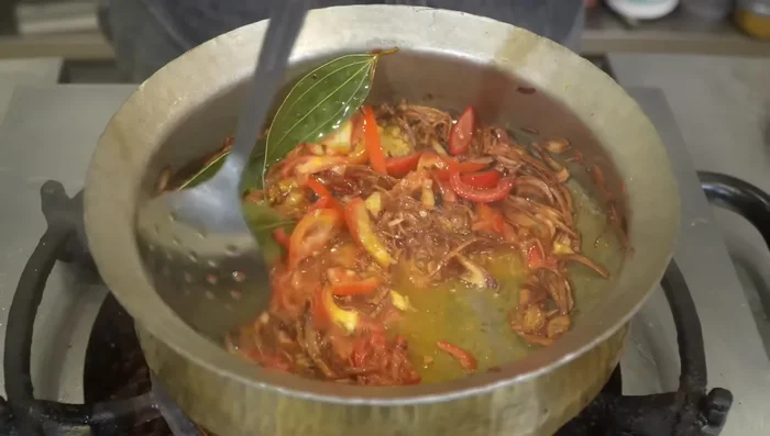 Add finely chopped tomatoes and cook until softened.