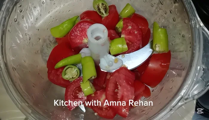 Chop the tomatoes and green chilies finely.