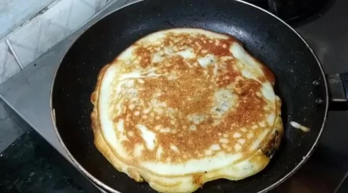 Flip the pancake and cook the other side until golden brown. (154.879)