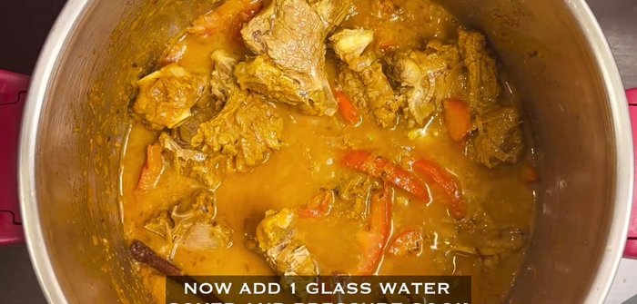 Add 1 glass of water, cover, and pressure cook for 6-7 minutes on medium heat.