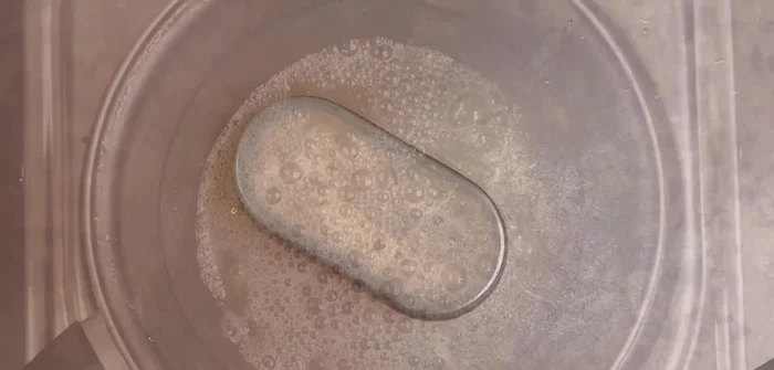 Prepare tadka: Melt butter and oil, add Kashmiri red chili powder, and fry briefly.