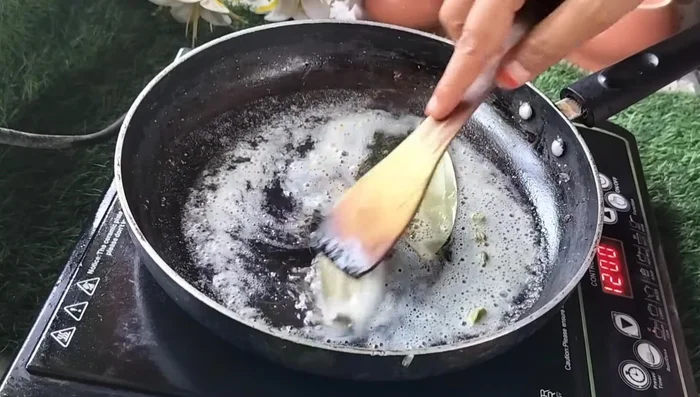 Add cumin seeds, cardamoms, and bay leaves to the pan and sauté until fragrant. (180.4)