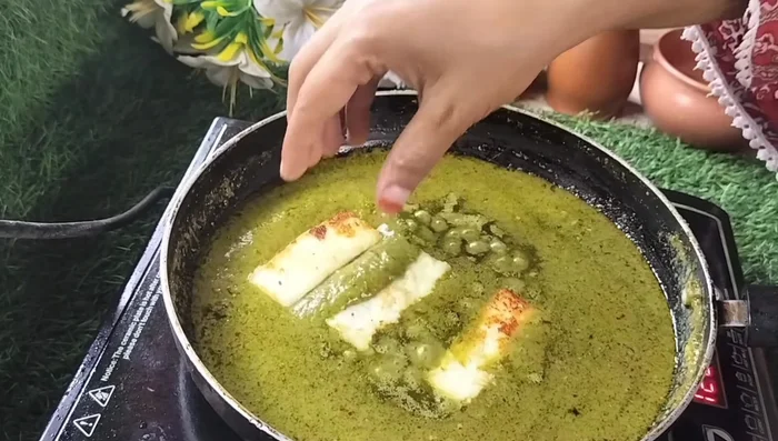 Add the fried paneer to the gravy and gently simmer for about 5 minutes, covered. (349.84)