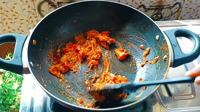 Once the dal is cooked, combine it with the sambar masala and tomatoes. Adjust consistency with hot water.