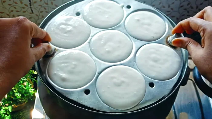 Steam the idlis in a preheated idli steamer for 10-15 minutes on high flame.
