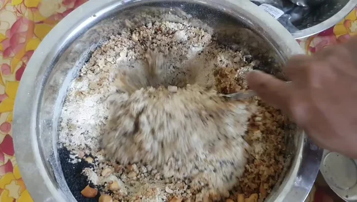 Add cardamom pods and sugar while grinding the chickpea flour.