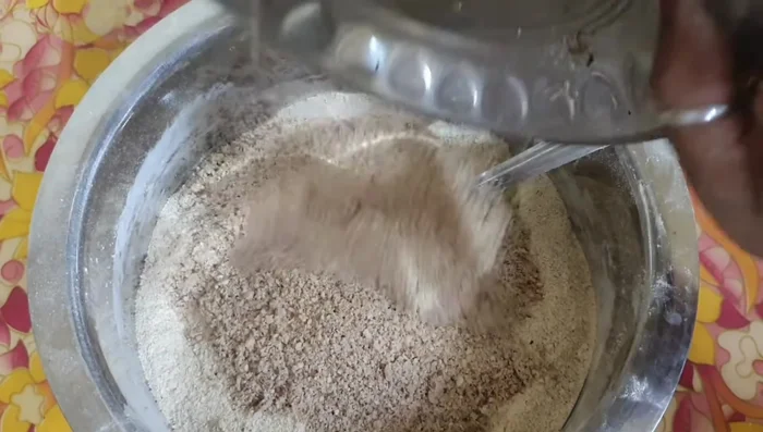 Chop dry roasted almonds and peanuts into small pieces.