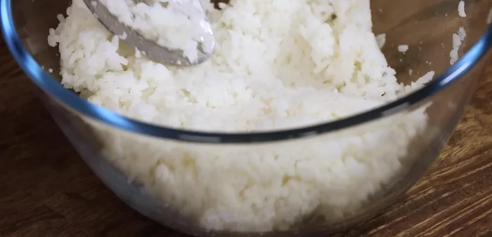 Mash 1/2 cup of cooled, cooked rice (optional).