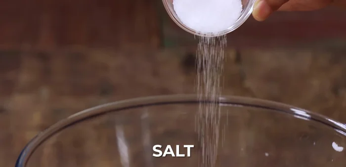Mix the mashed rice with the whisked curd and 1 teaspoon of salt.