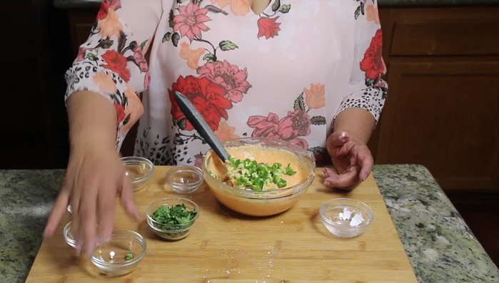 Add ginger and green chilies to the batter. Mix thoroughly.
