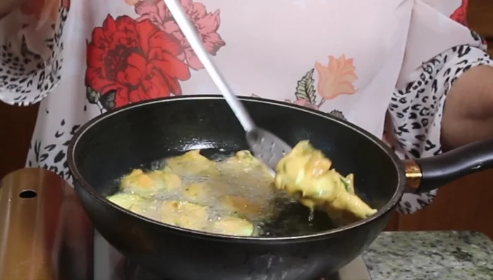 Fry the pakoras until golden brown, about 4-5 minutes on each side.