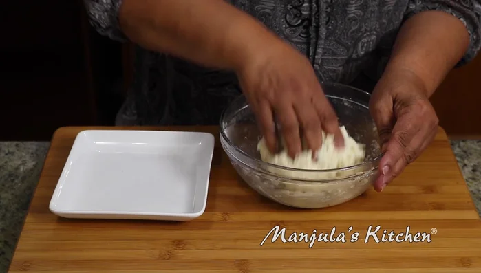 Knead the dough again until smooth. Divide it into 14 equal parts.